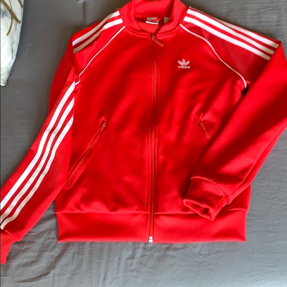 Red adidas jacket with white on the side